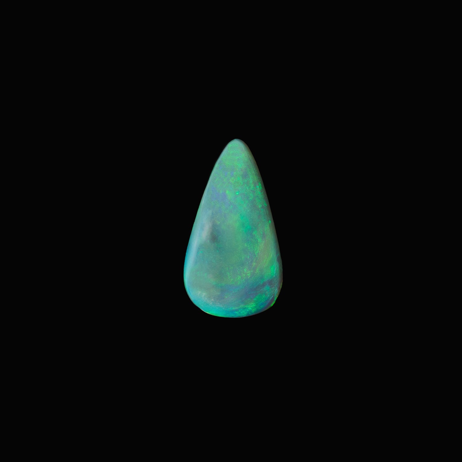 Teardrop-shaped opal gemstone on a black background