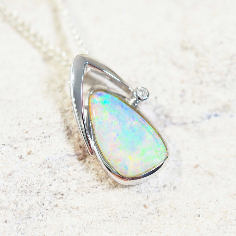 opal pendant set with a crystal opal and one diamond