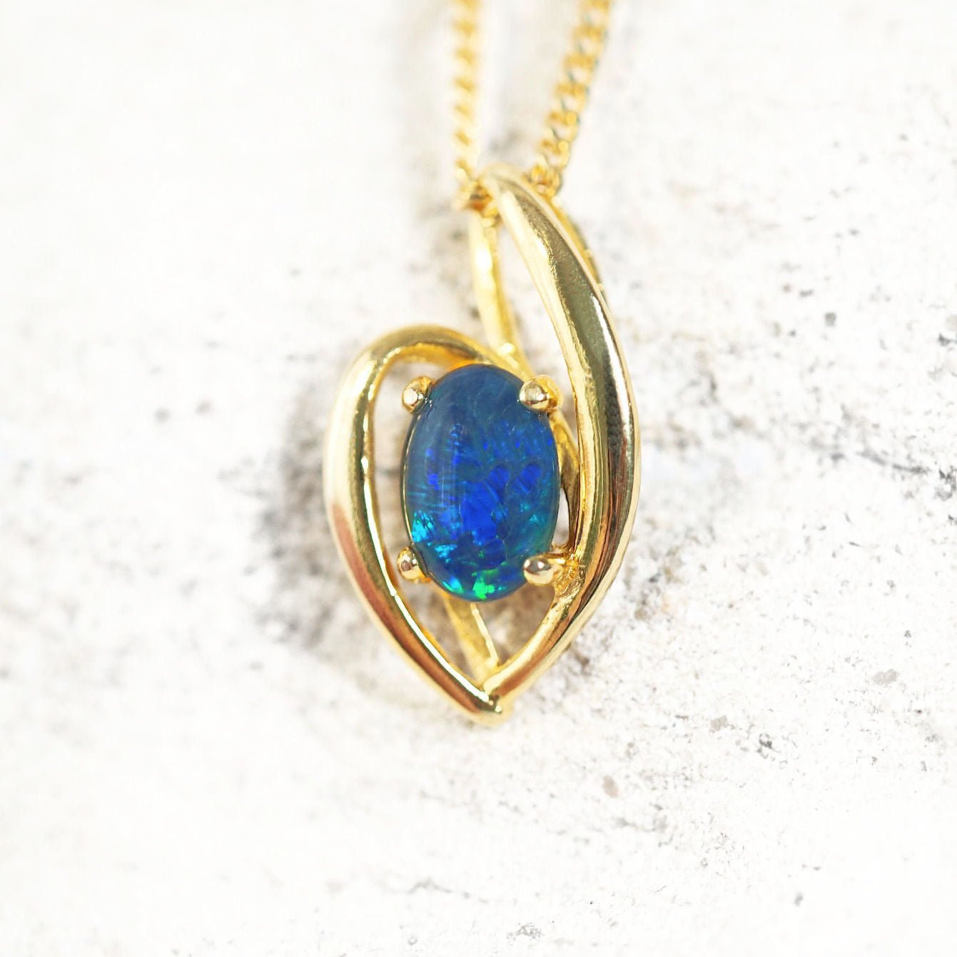 blue and green triplet opal pendant in gold plated silver