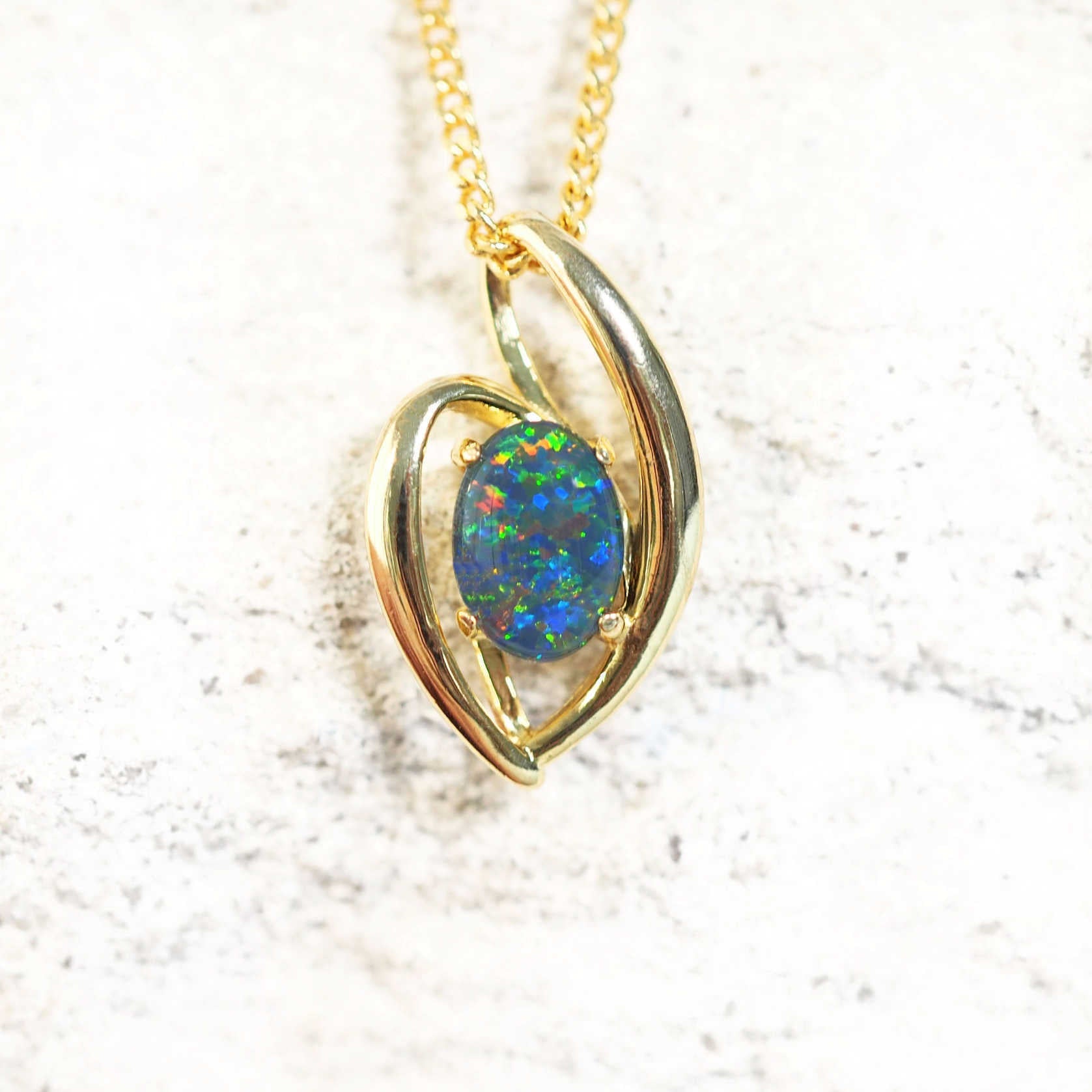 colourful opal pendant set in gold plated silver