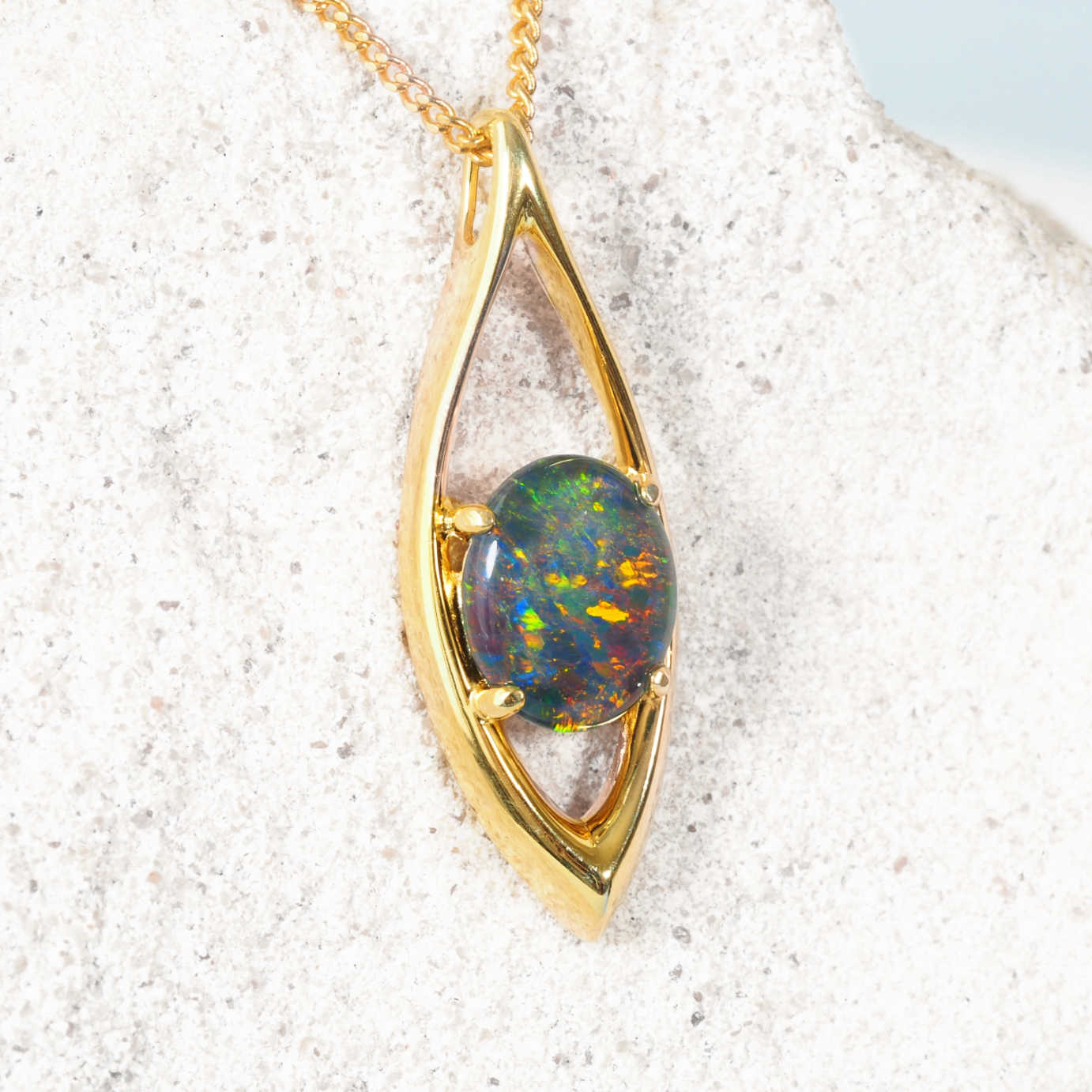 colourful opal pendant set in gold plated silver