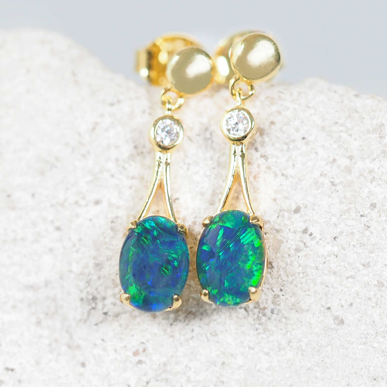 Elegant Marilyn Blue opal earrings with vintage-inspired chandelier design.