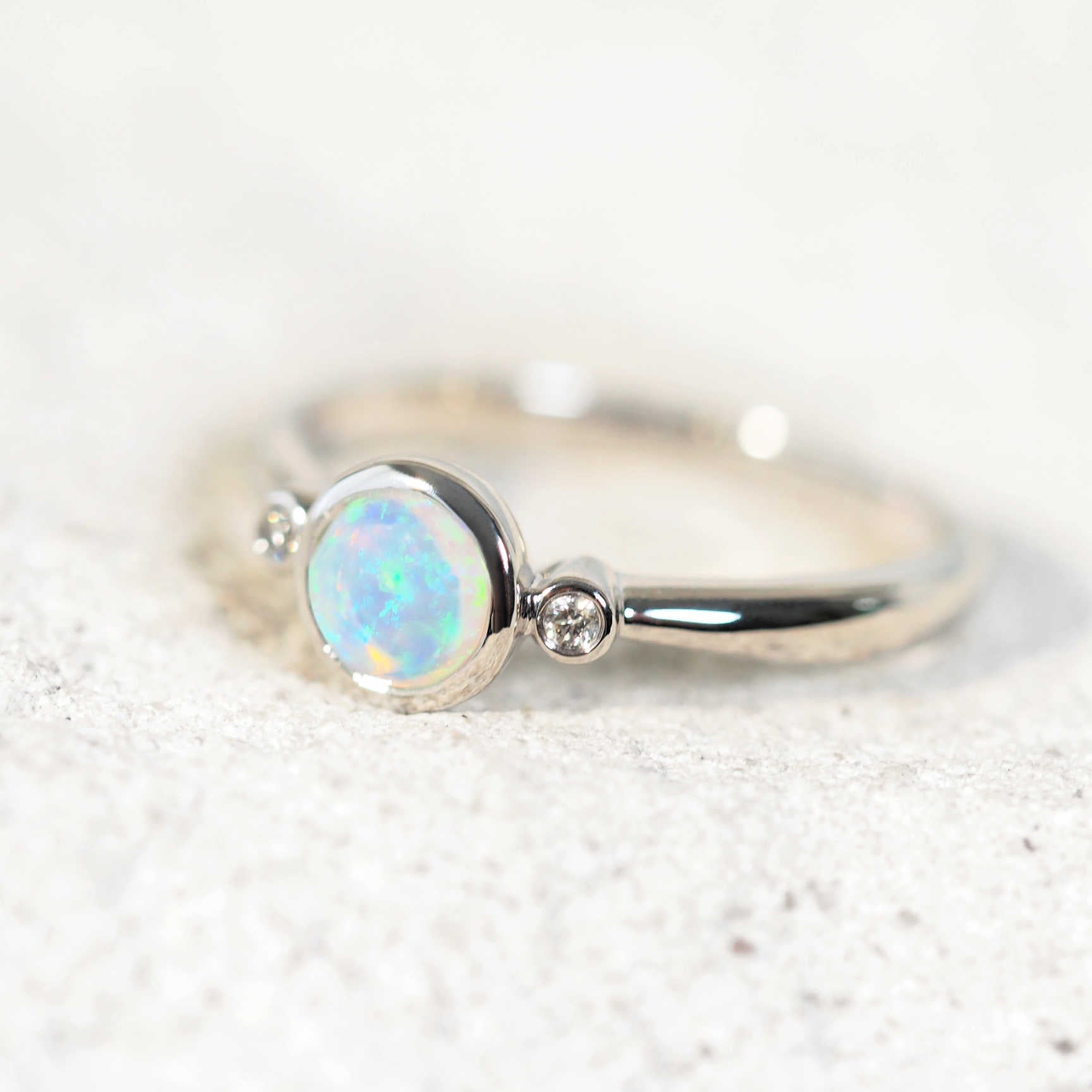 Mariselle opal ring with bezel-set green opal and white diamonds