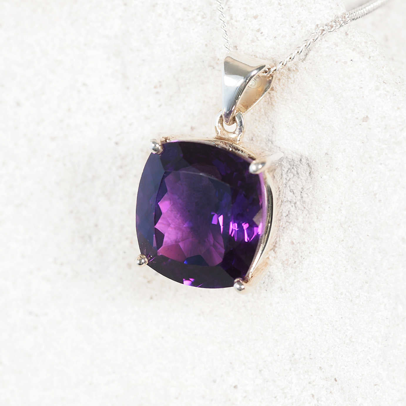 The 'Milena' pendant with deep purple square Amethyst securely set in a polished silver claw bezel