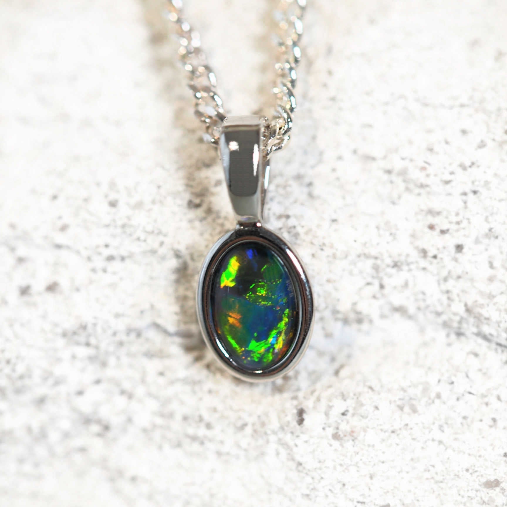 colourful elegant opal pendant in silver