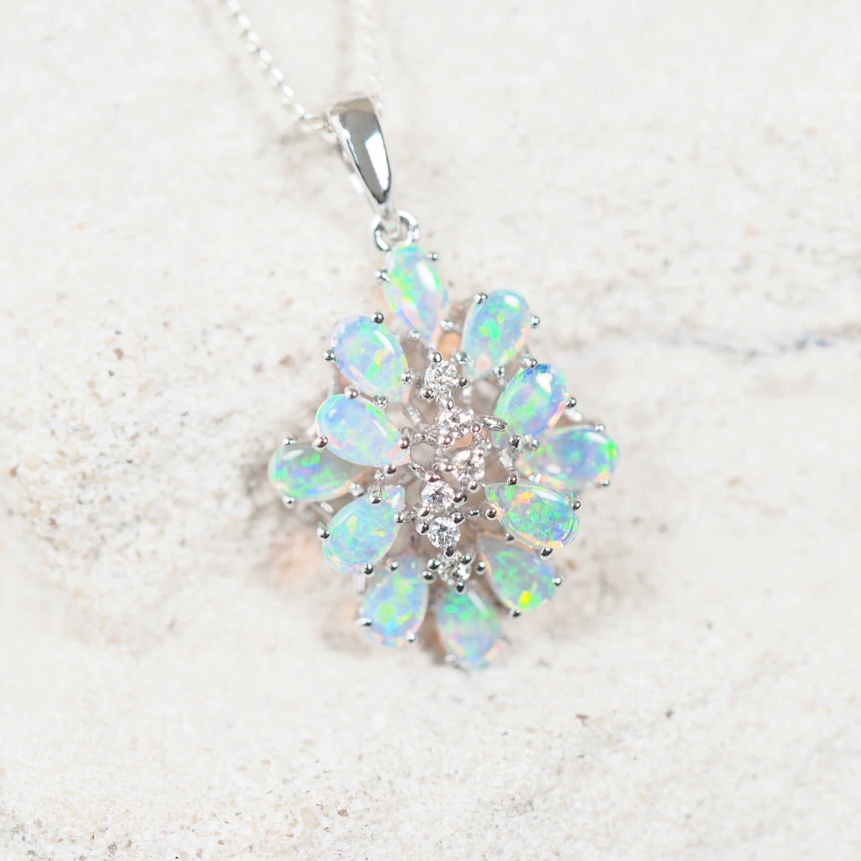 crystal opal cluster pendant set in white gold