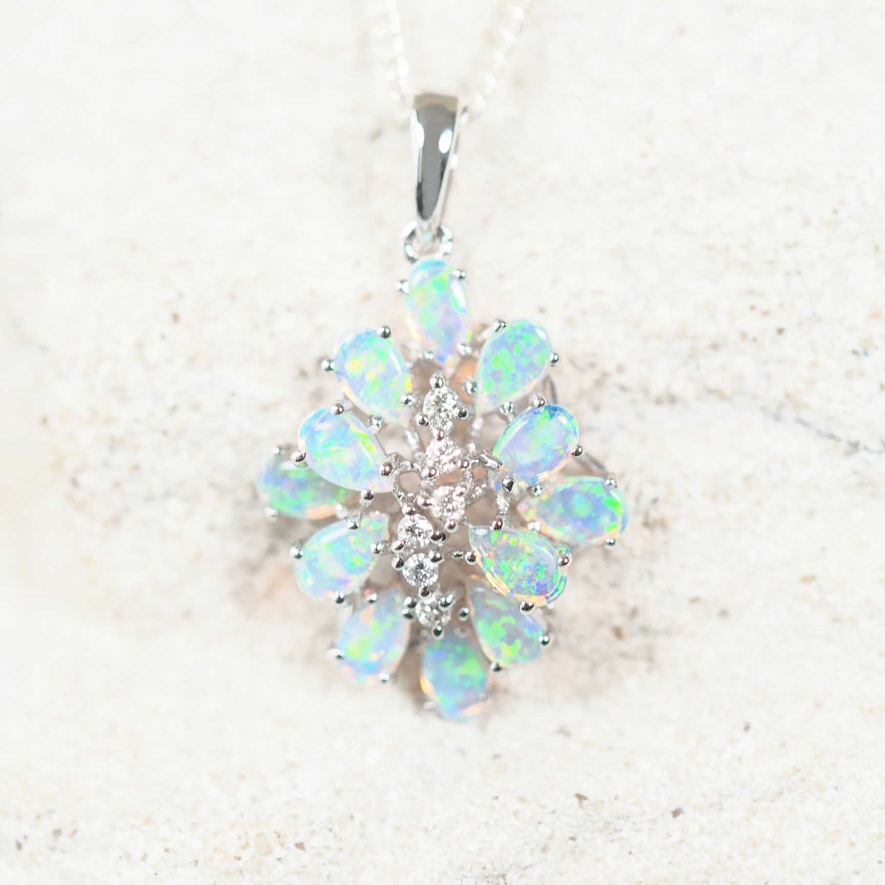 opal pendant setr in 14ct white gold set with 12 crystal opals