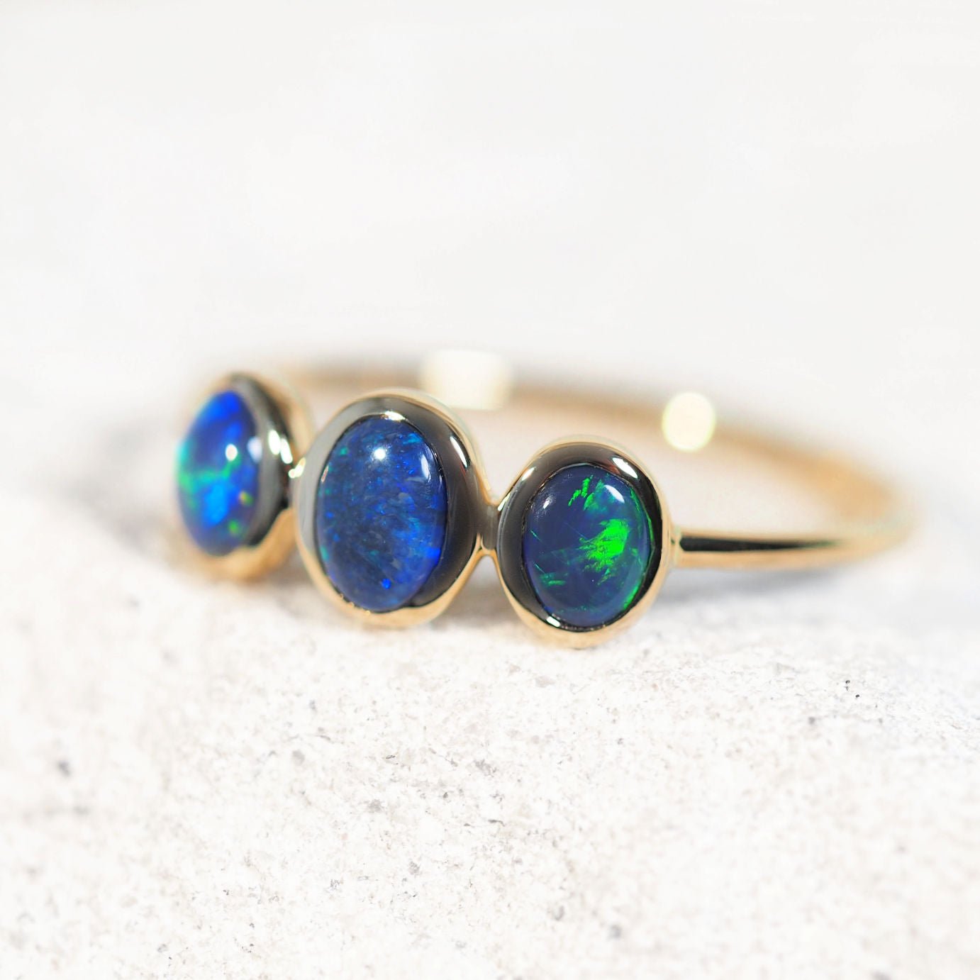 ‘Nyara’ 14ct yellow gold opal ring – triple Lightning Ridge black opals with vivid blue-green colour