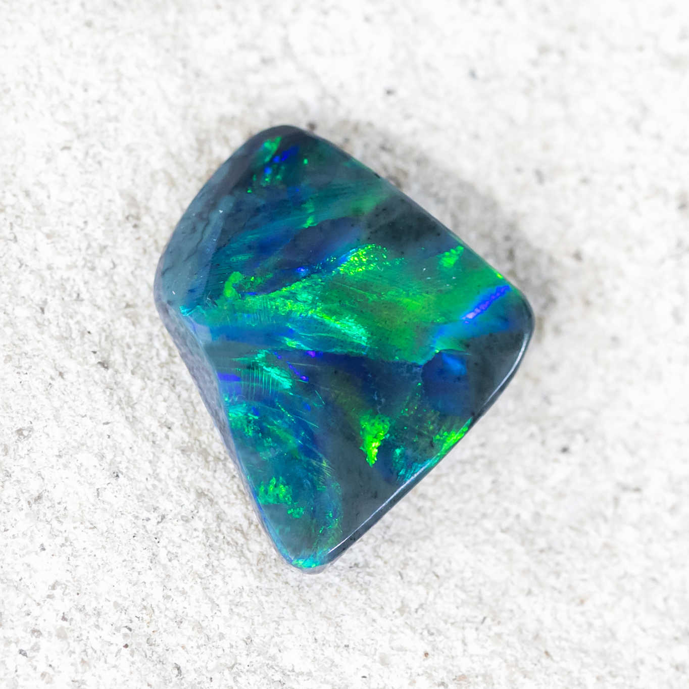 Ocean Stingray black opal showing vibrant broadflash pattern in natural light