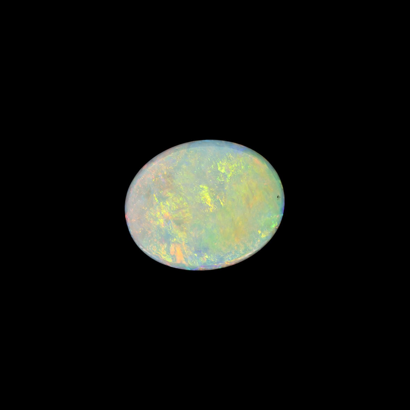 Opal stone with multicolored patterns on a black background