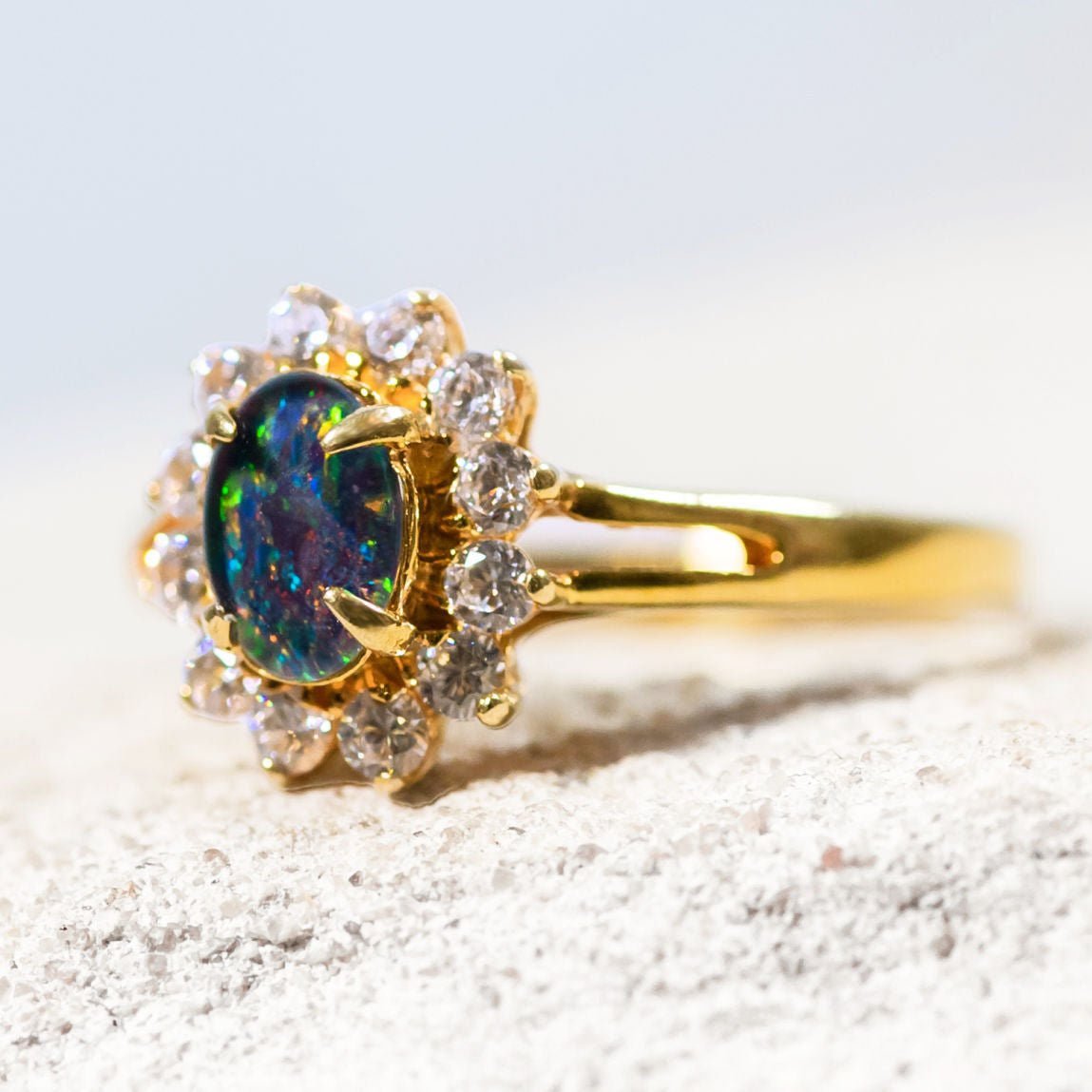 opal ring set in gold plated silver with a princess design