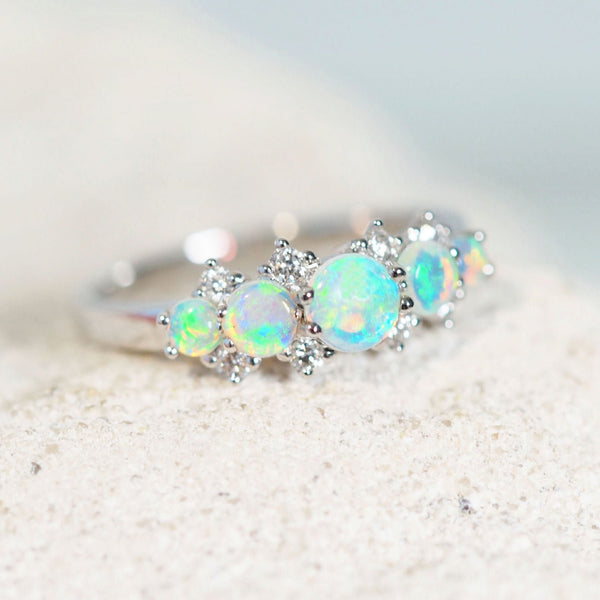 diamond ring with opal from australia in a green-blue tones