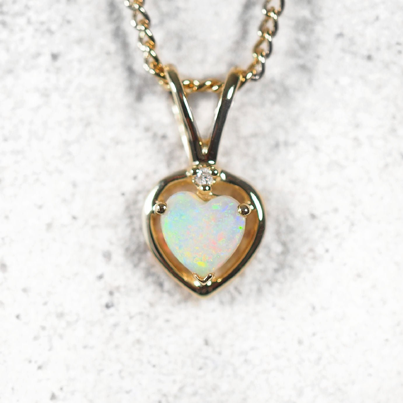 colourful opal pendant set in 9ct gold