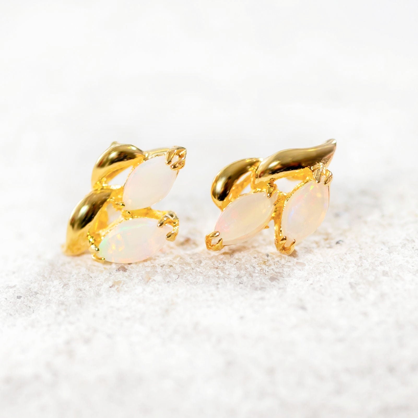 delicate opal earrings set in gold plated silver