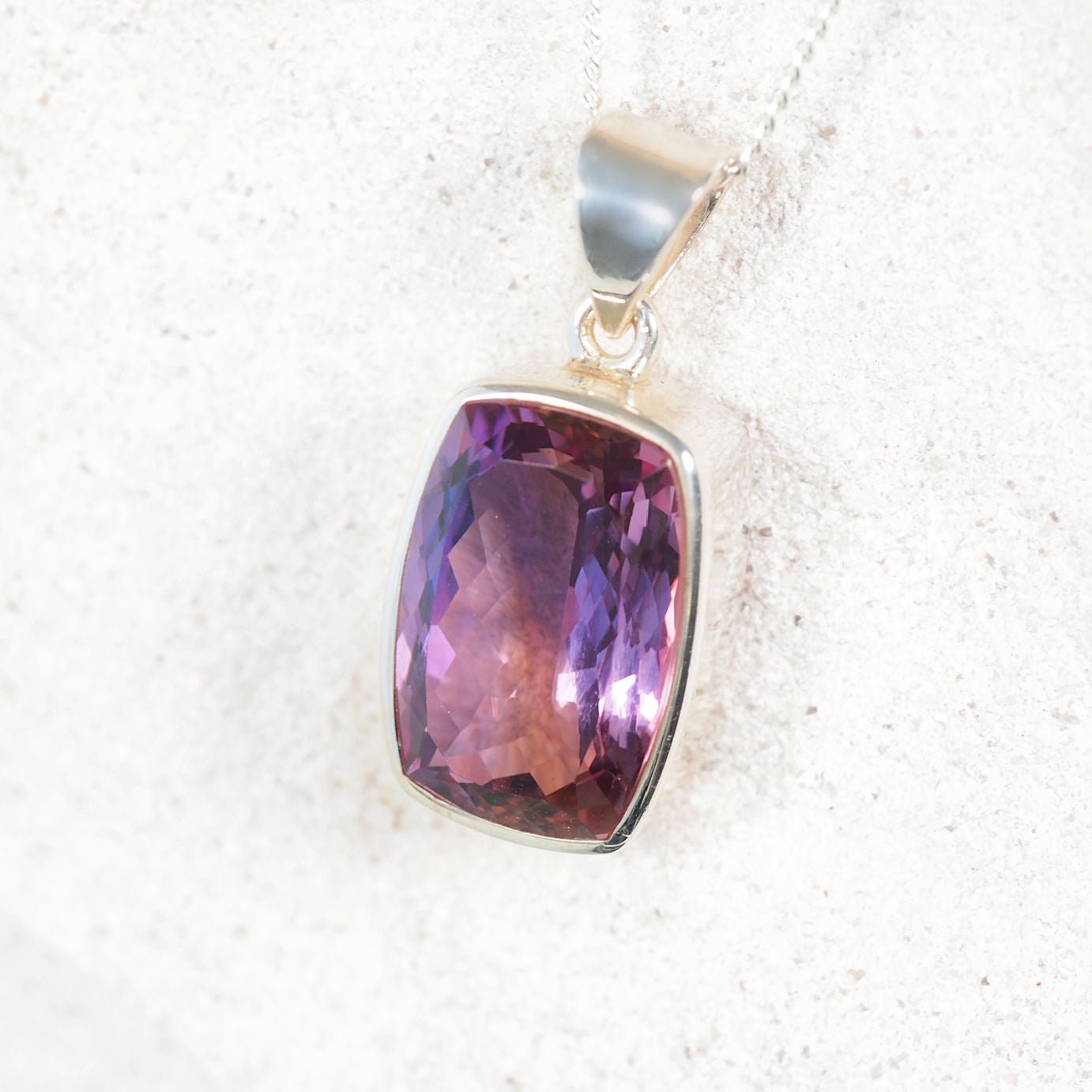 Amethyst Pendant displaying purple tones with silver setting