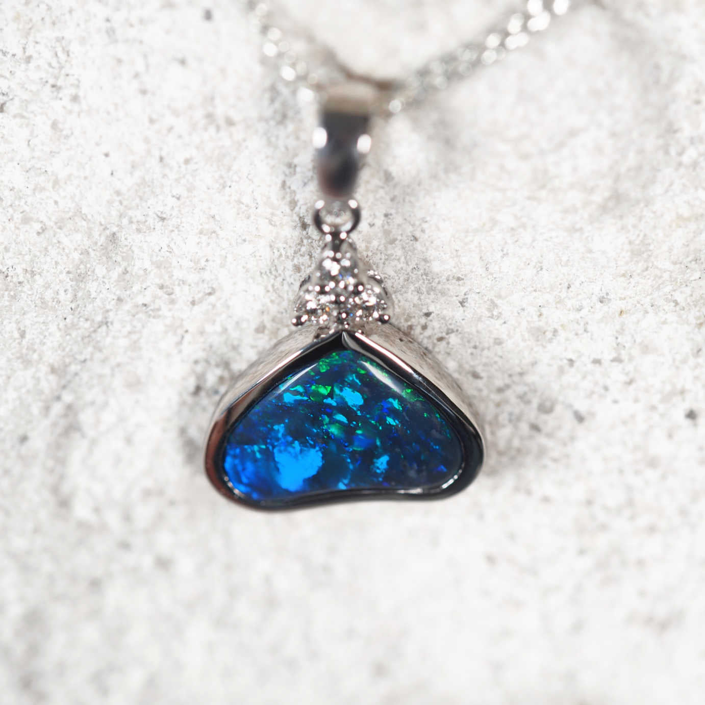 Elegant Australian black opal pendant with bezel-set opal and diamond trio crown – ‘Seren’ by Black Star Opal