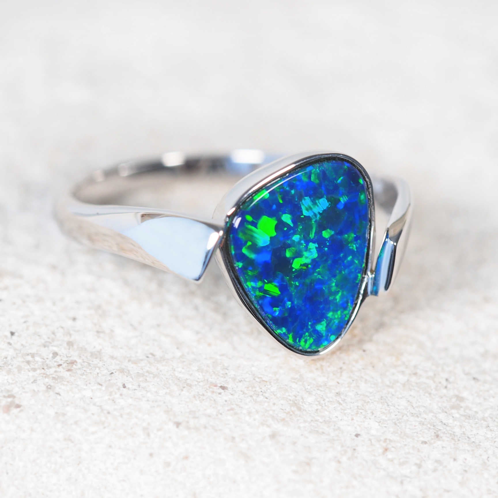Unique modern opal ring with triangular Australian doublet opal and polished white gold band
