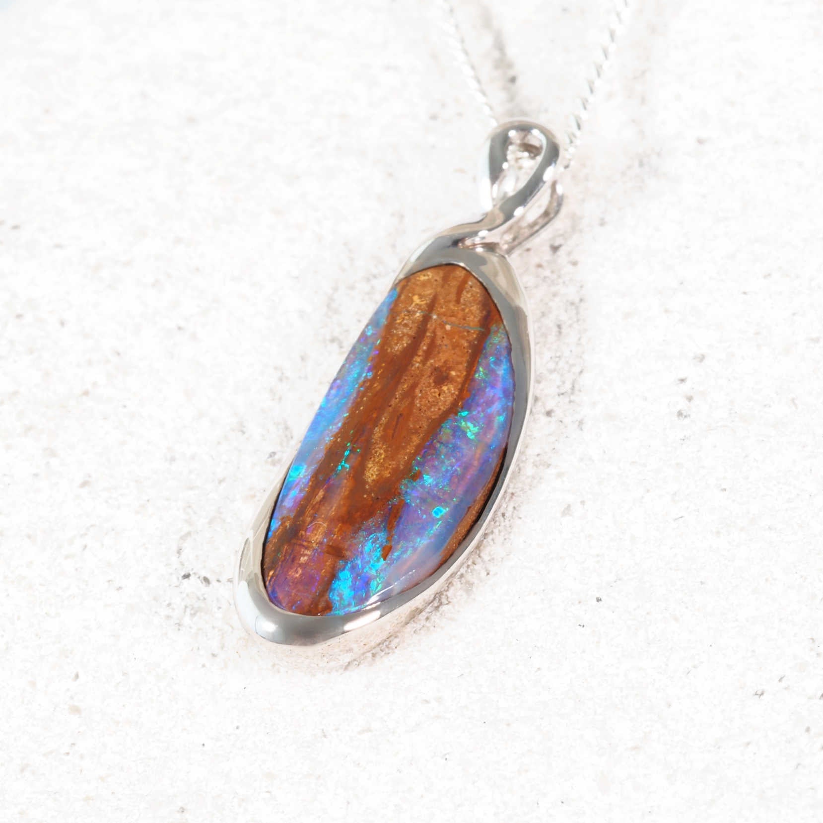 Australian boulder opal necklace showing vibrant blue-green play-of-colour