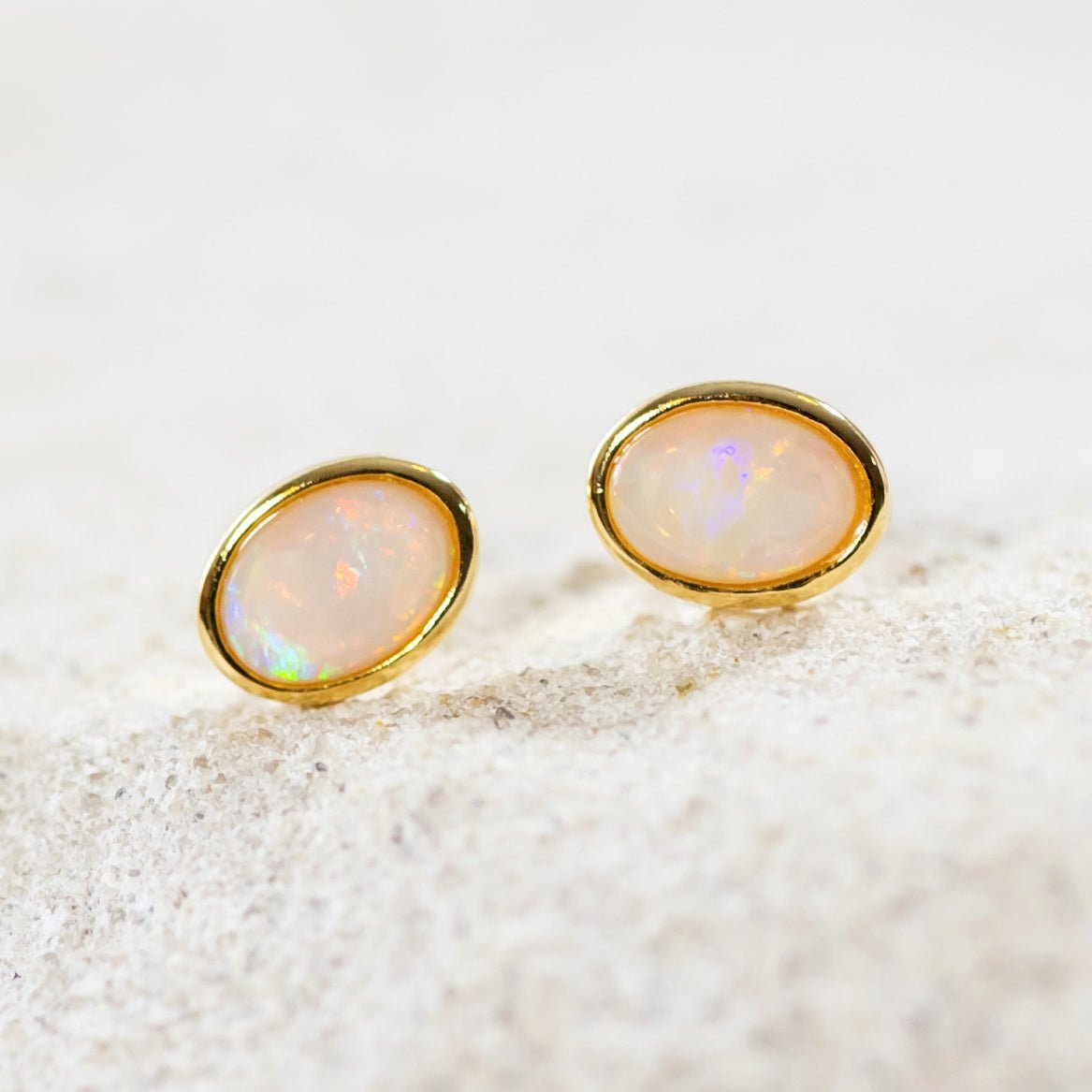 oval crystal opal earrings set in gold plated silver