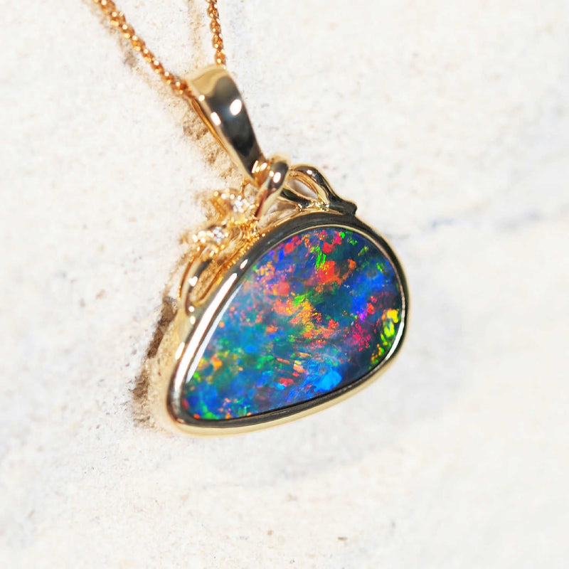opal and diamond pendant set with a colourful australian opal