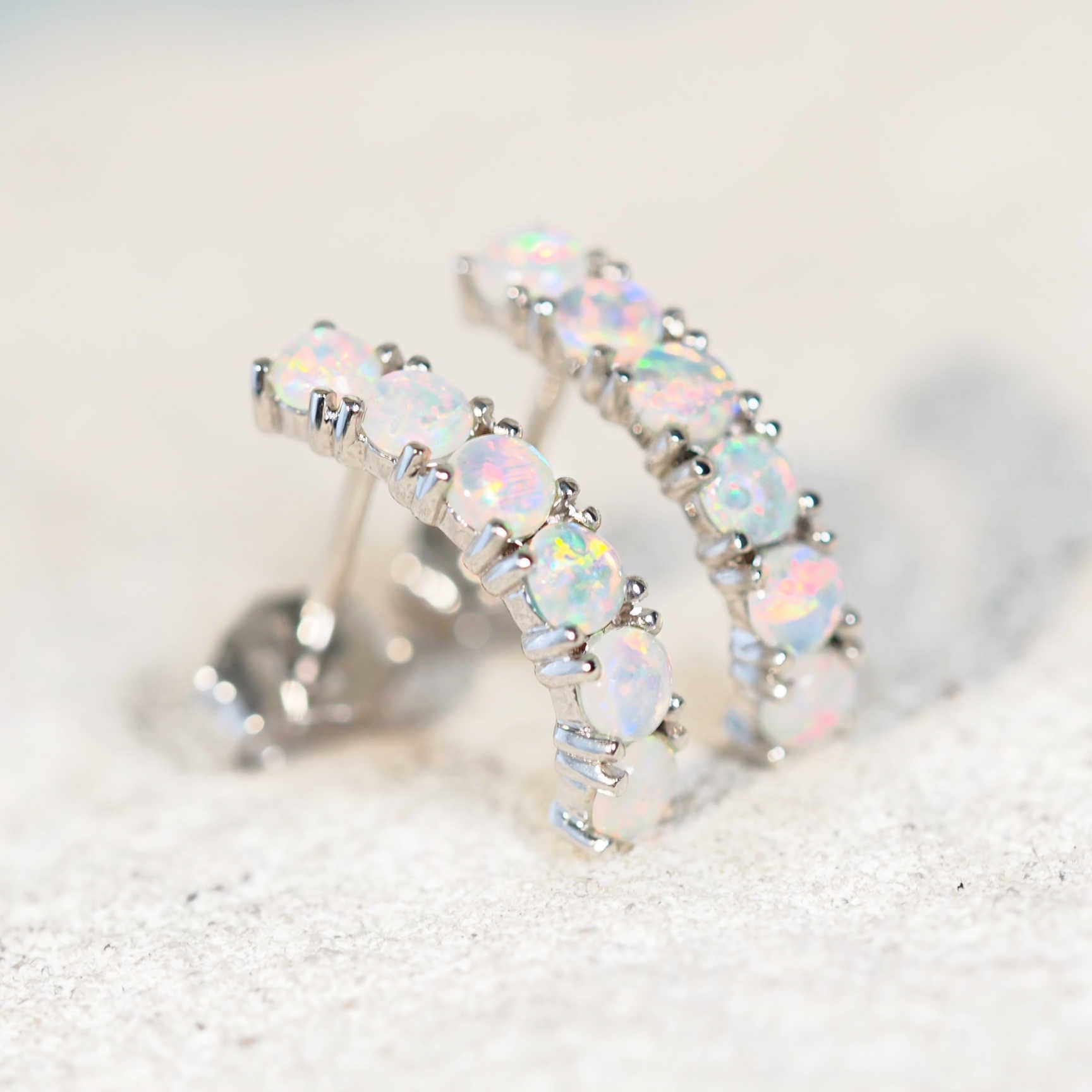 opal earrings set in white gold featuring 12 australian colourful gemstones