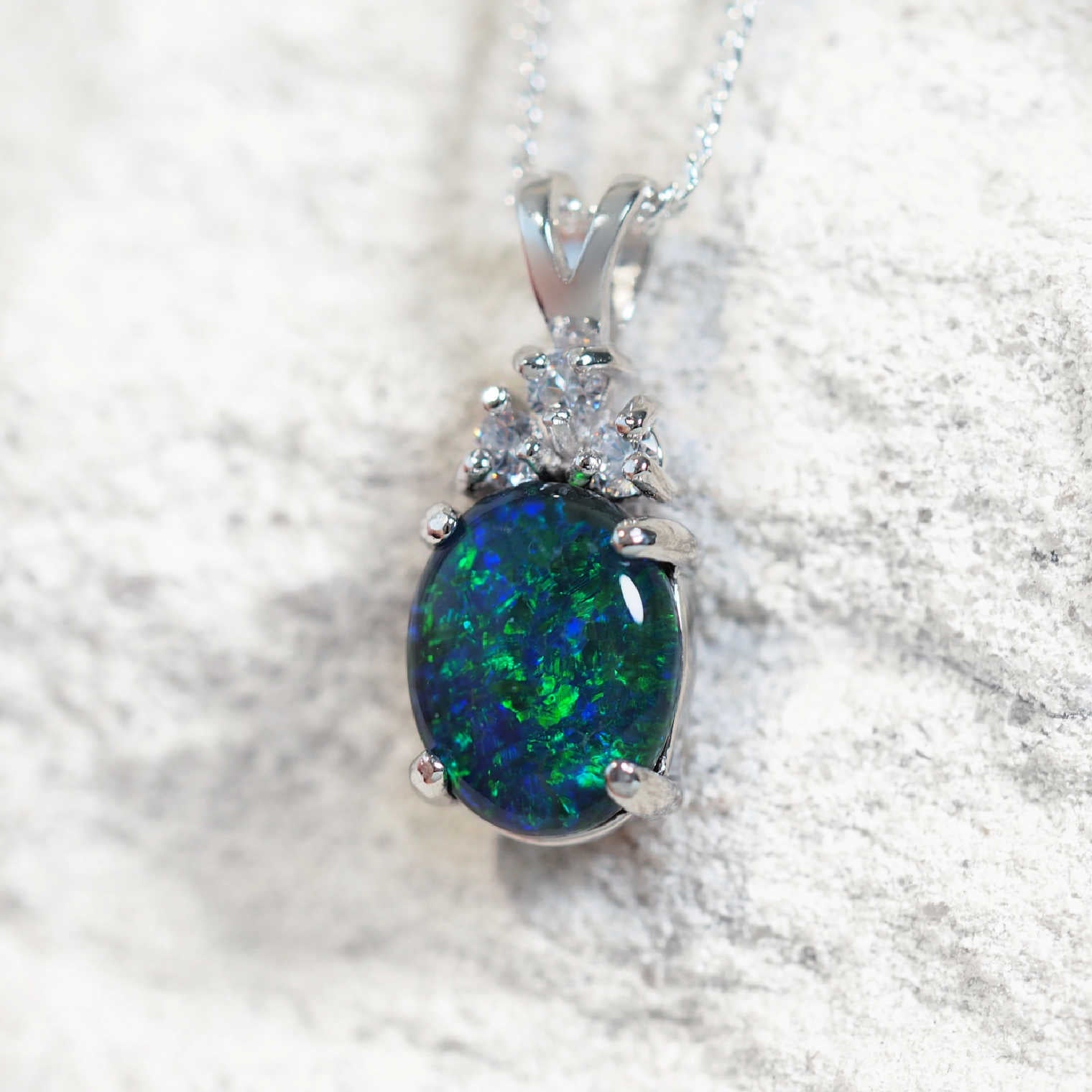 'Trinity Blue Midi' opal pendant in sterling silver with claw-set oval Australian triplet opal and three sparkling cubic zirconias