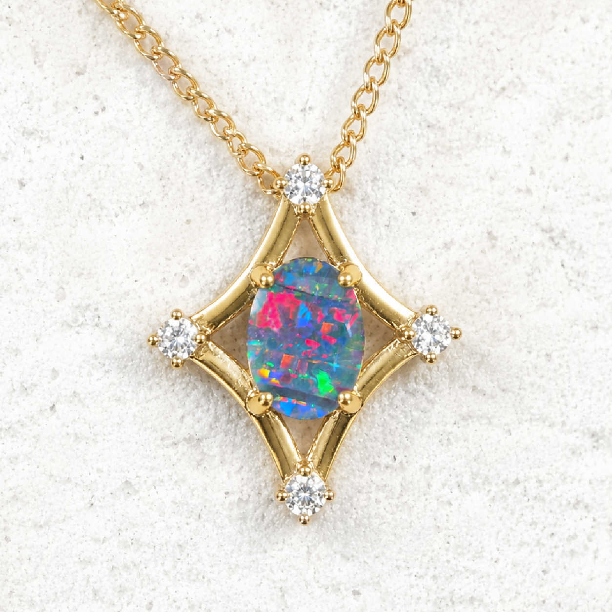 Gold plated silver opal pendant with a colourful Australian opal and four diamantes