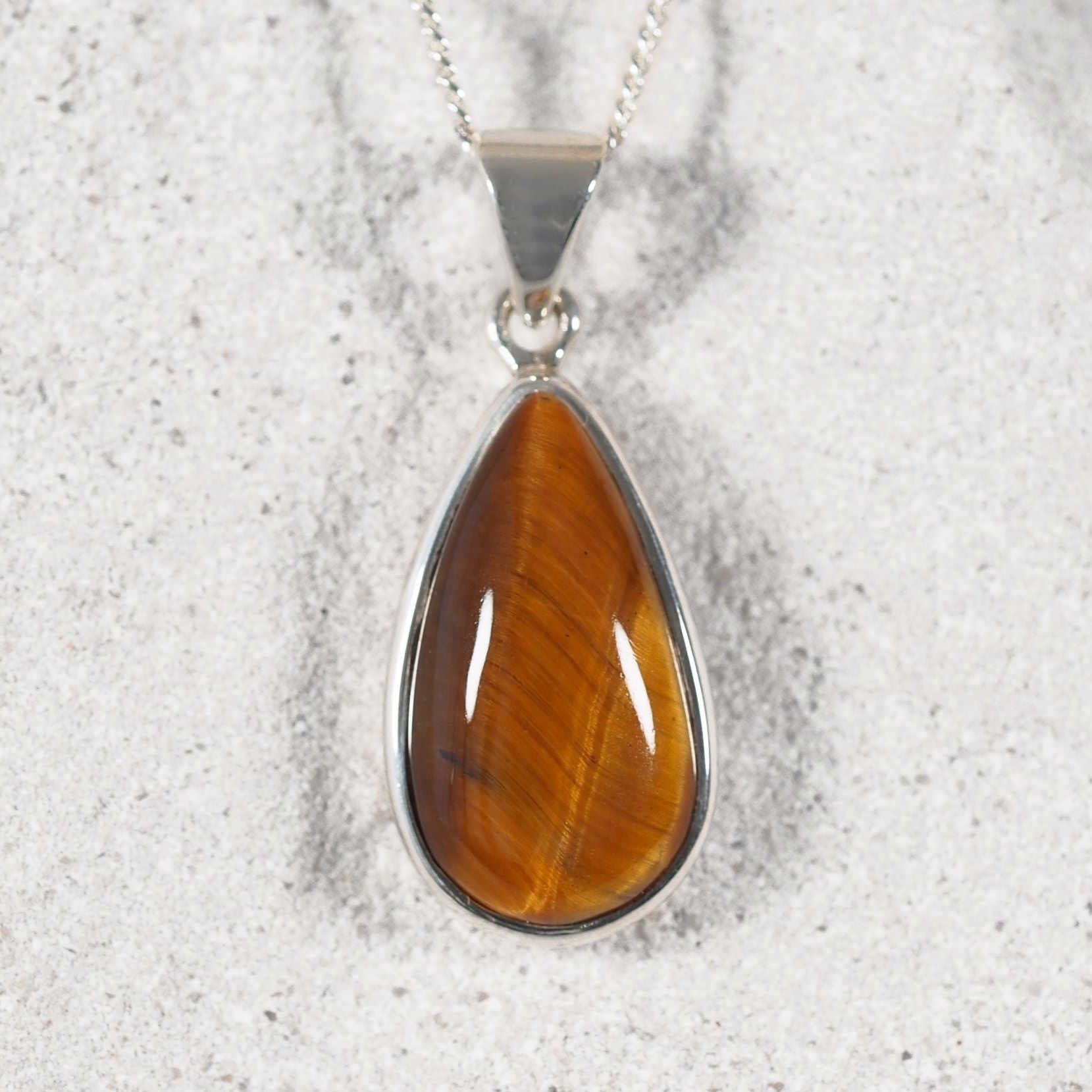 teardrop style tiger-eye pendant with silky sheen