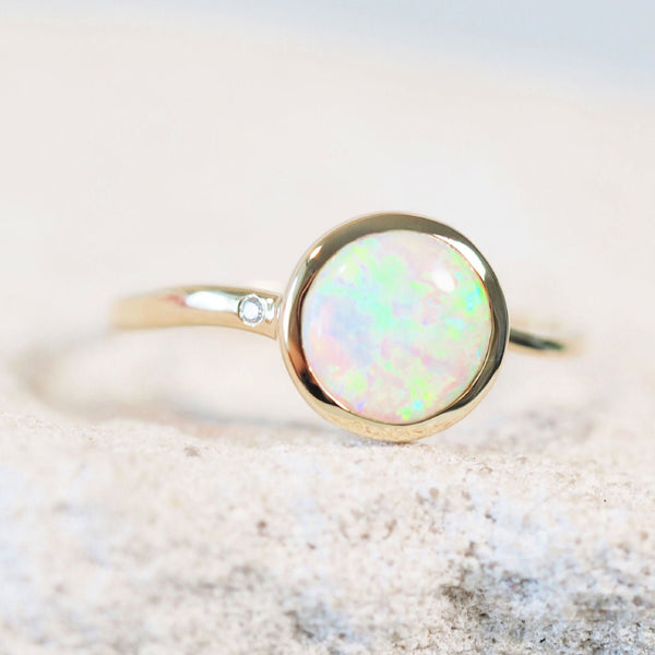 green crystal opal engagement ring set in 14ct gold with one diamond