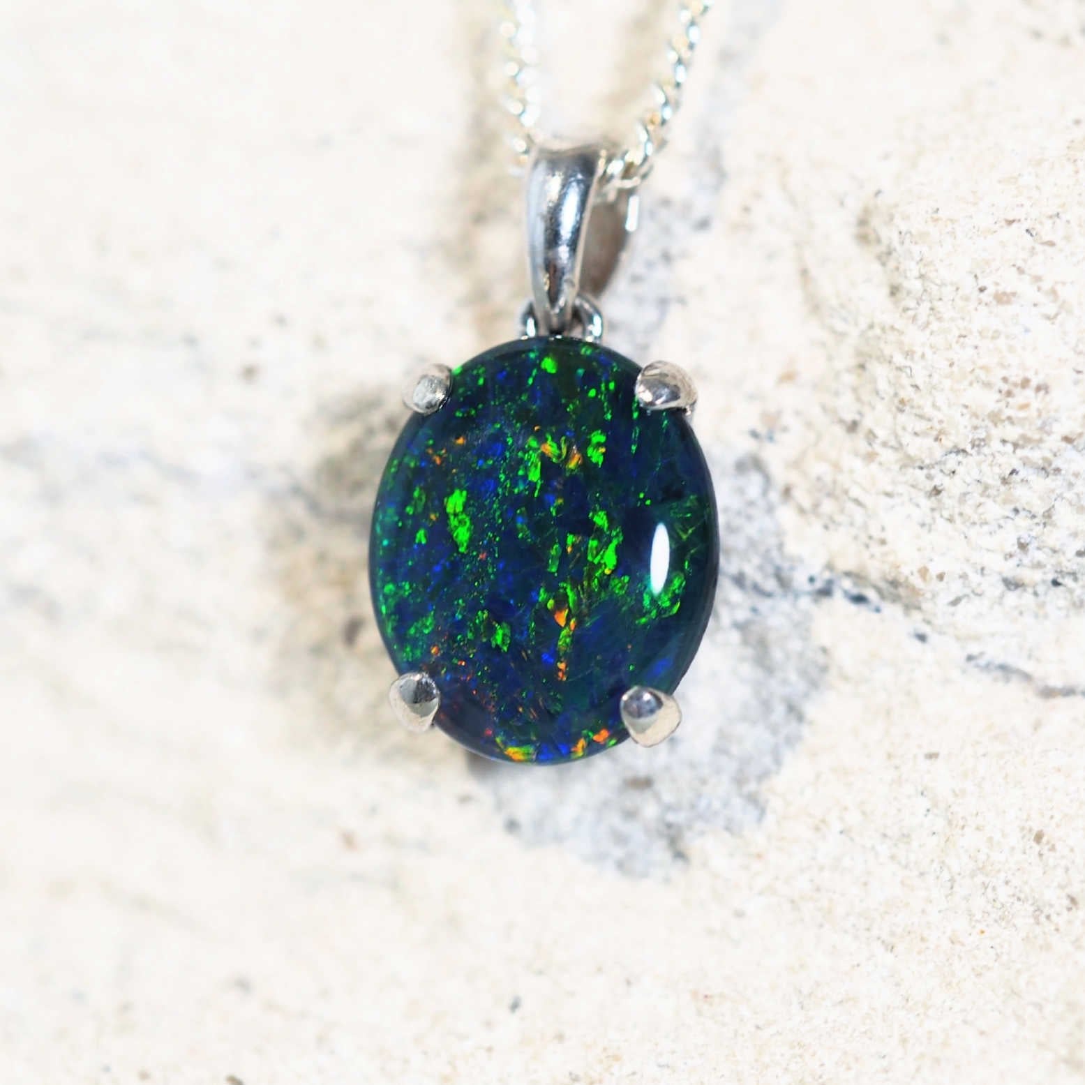 blue australian opal necklace pendant featuring a multi-coloured triplet opal set into sterling silver