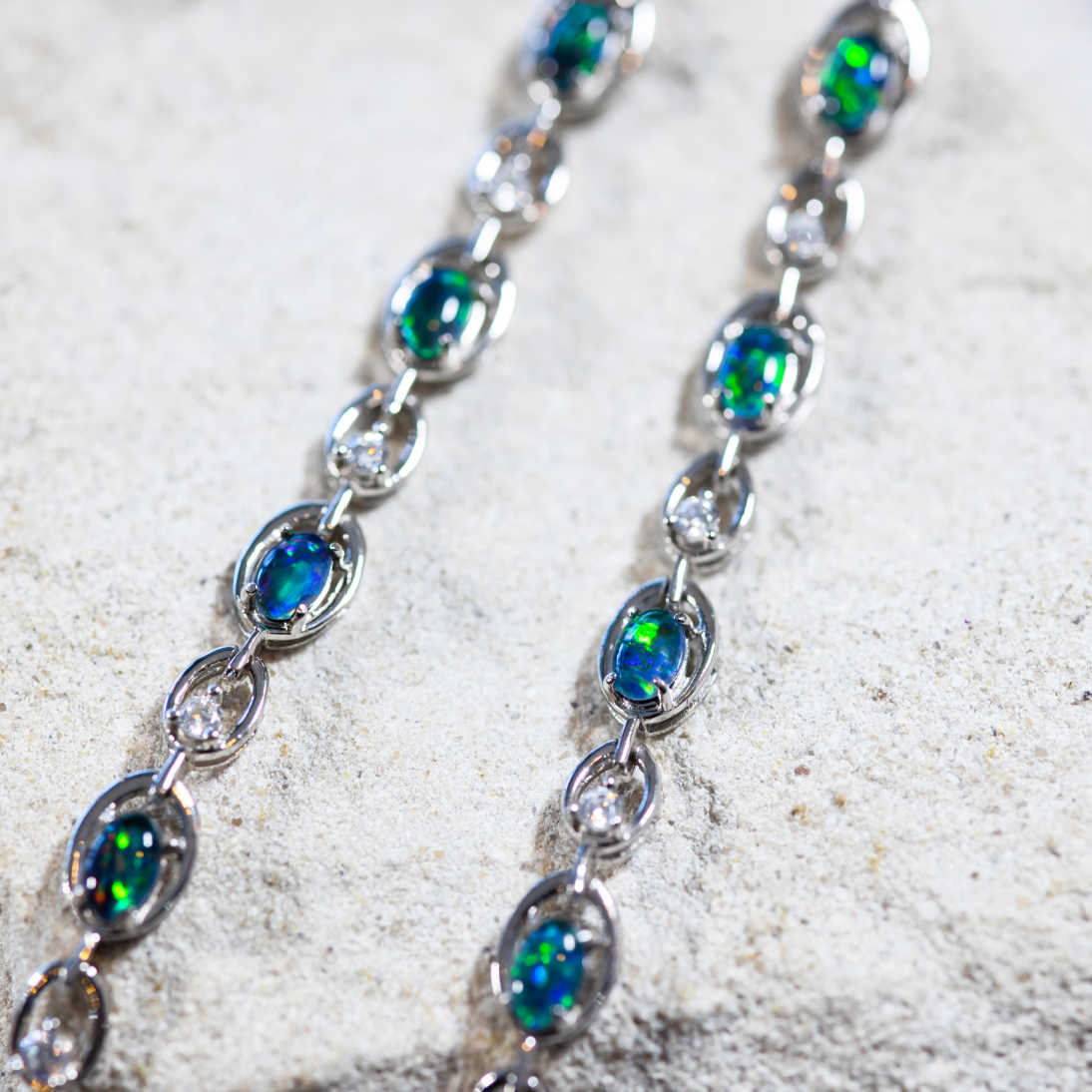 Sterling silver 'Classic Link' opal bracelet with five oval Australian triplet opals and sparkling crystal detailing, adjustable fit