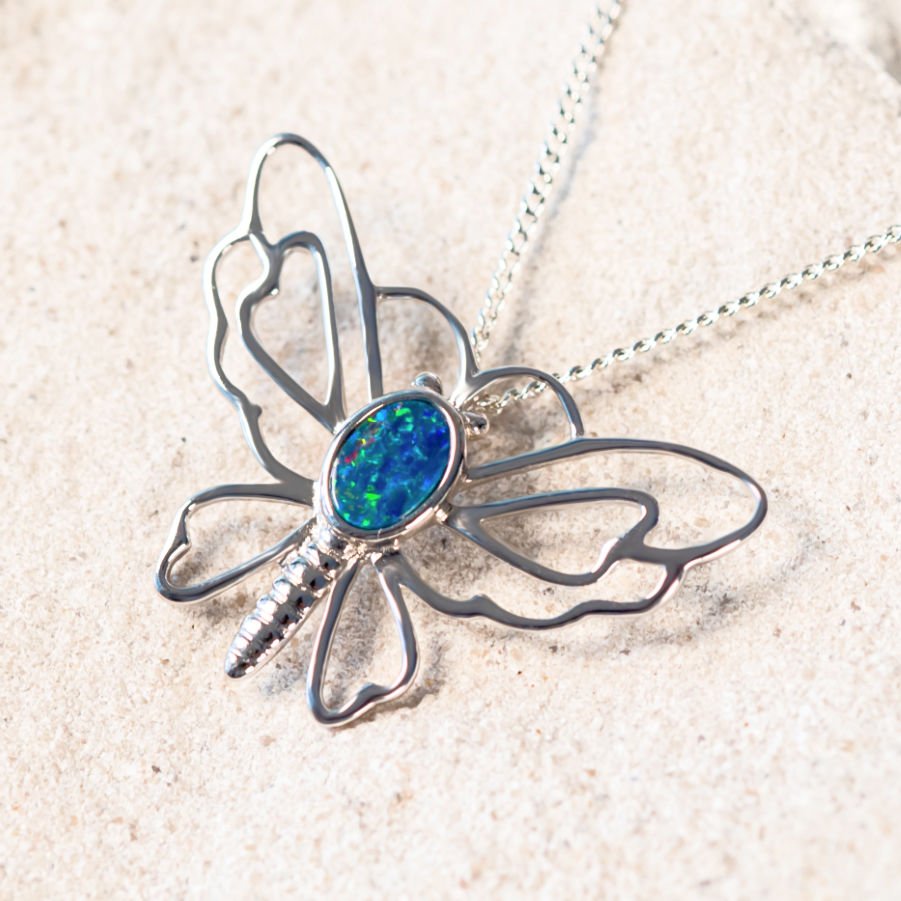 silver butterfly design pendant set with a colourful doublet opal