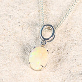 white opal gold pendant with a diamond