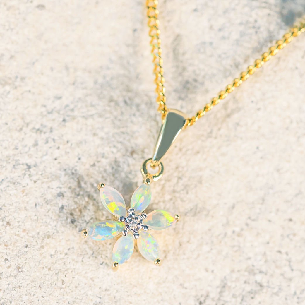 gold opal pendant set with a crystal opal in gold