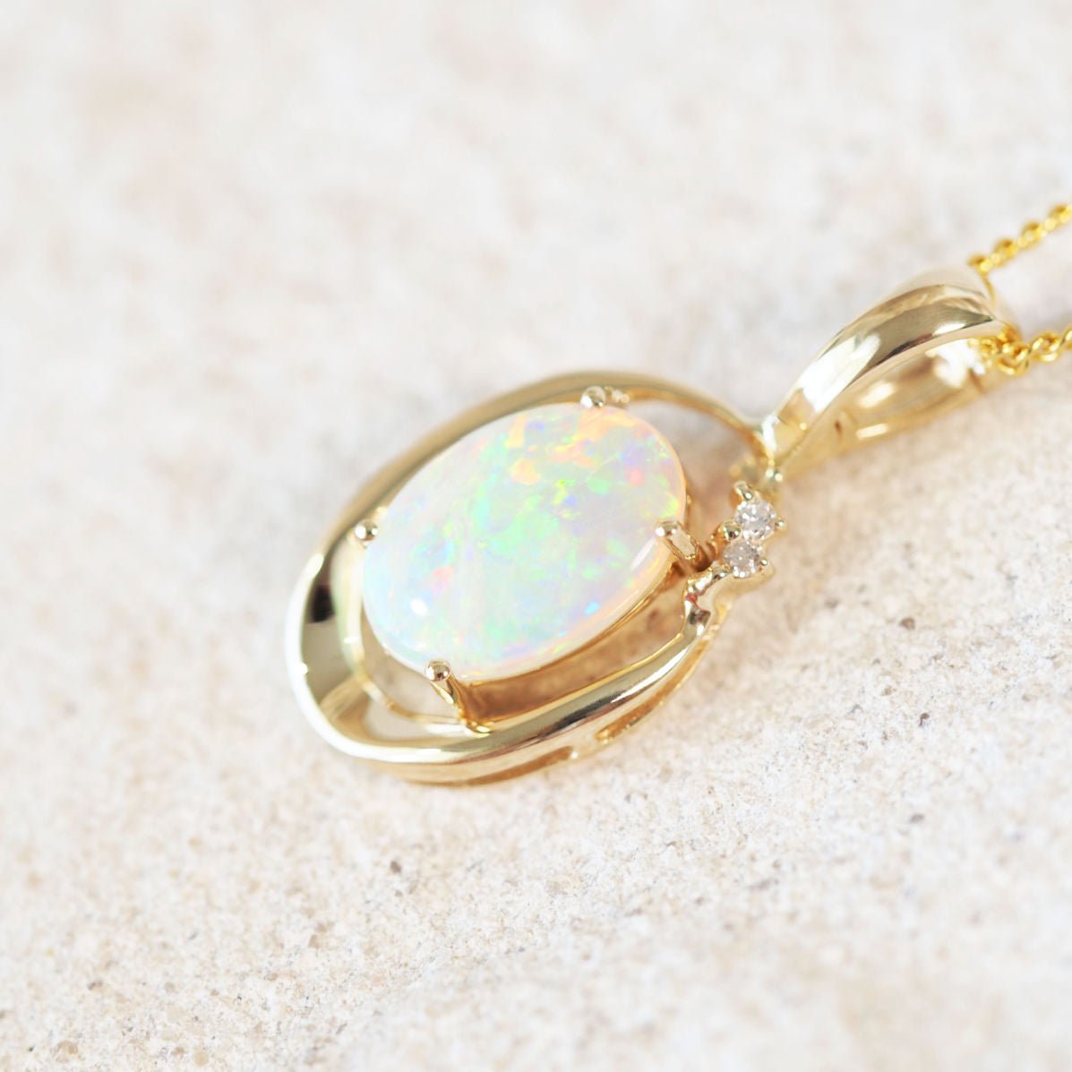 colourful crystal opal gold pendant with two diamonds