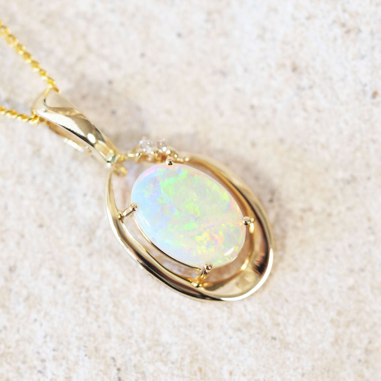 colourful crystal opal gold pendant with two diamonds