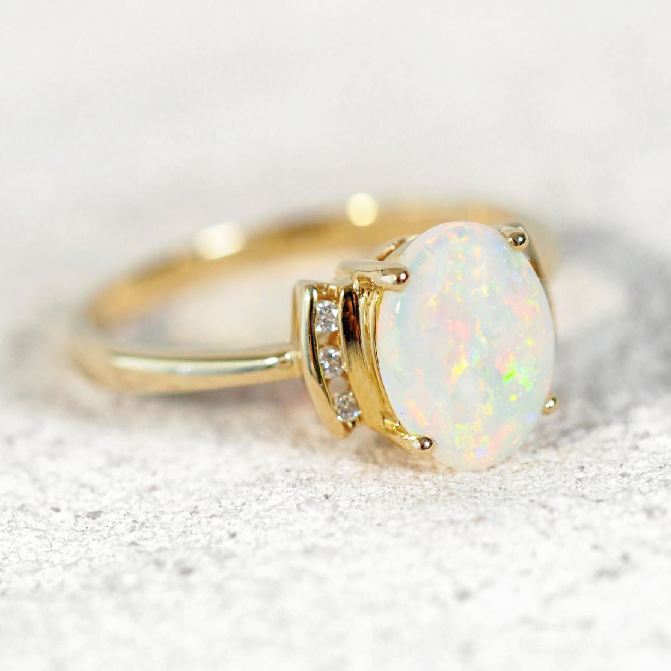 crystal opal and diamond ring set in 14ct yellow gold