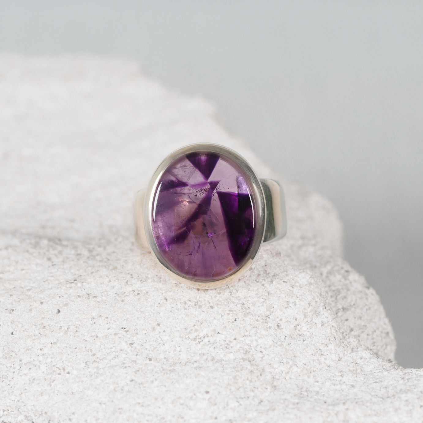 The ‘Jasmine’ silver ring with a small circular cabochon gemstone in natural tone