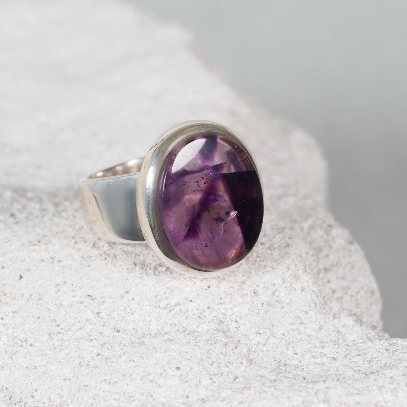Elegant silver ring, ‘Jasmine,’ featuring a small cabochon with subtle colour variations