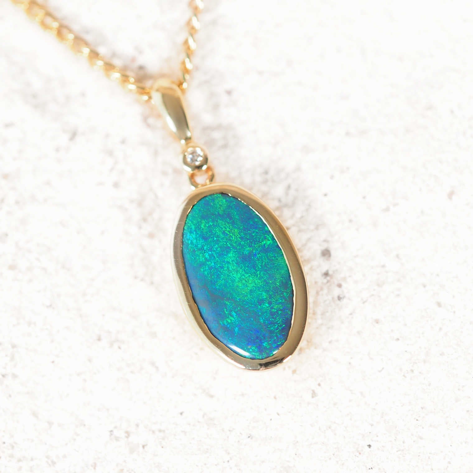‘Elsa’ 14ct yellow gold black opal pendant with Lightning Ridge opal and white diamond