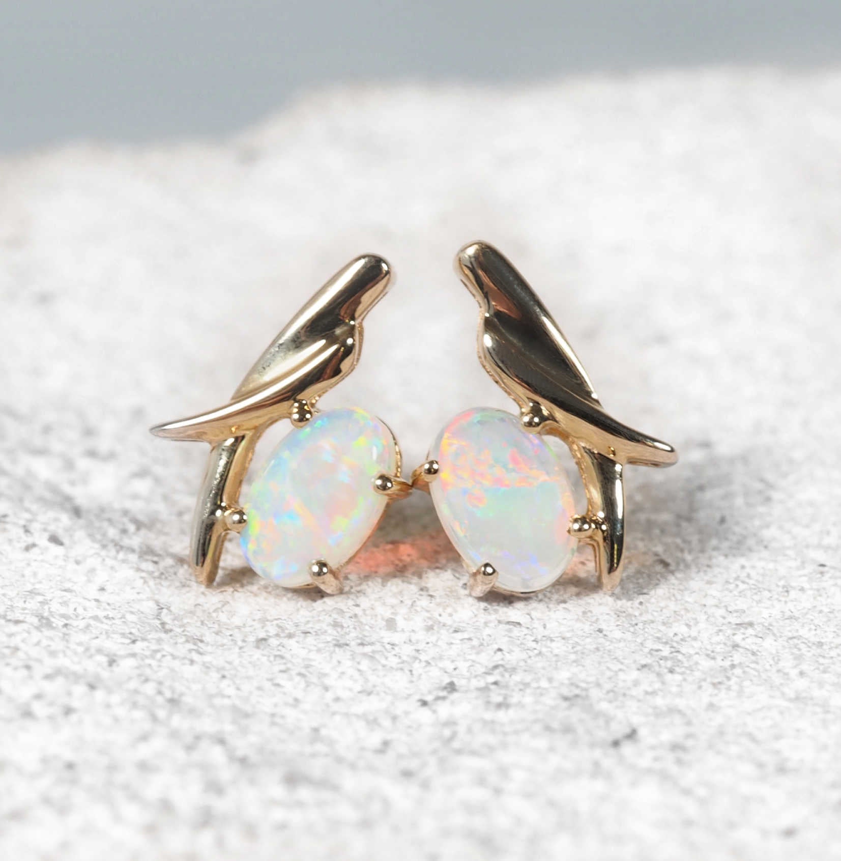 opal stud earrings in 14ct yellow gold featuring oval South Australian crystal opals