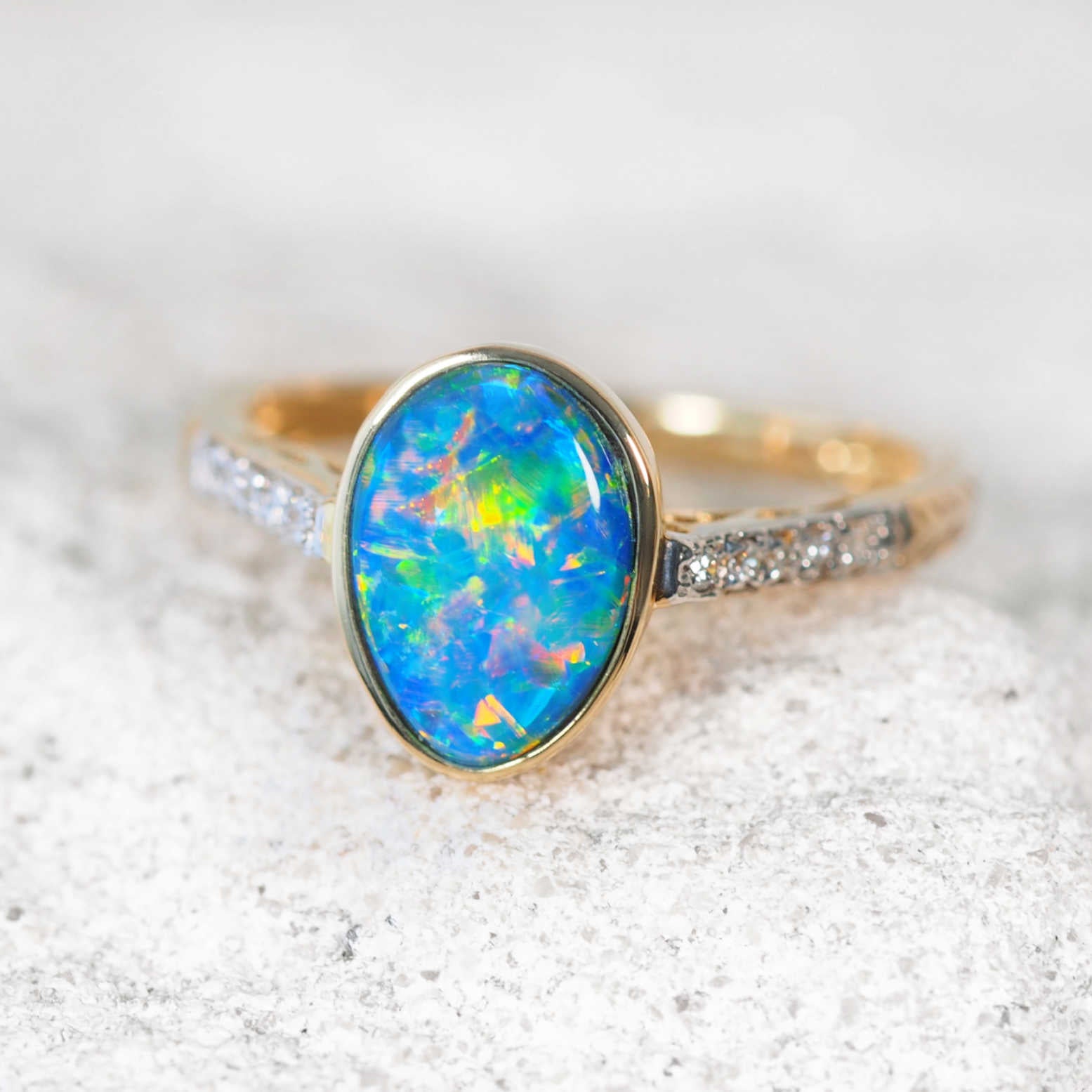 Liora opal ring in 14ct yellow gold with oval Australian doublet opal and diamond shoulders