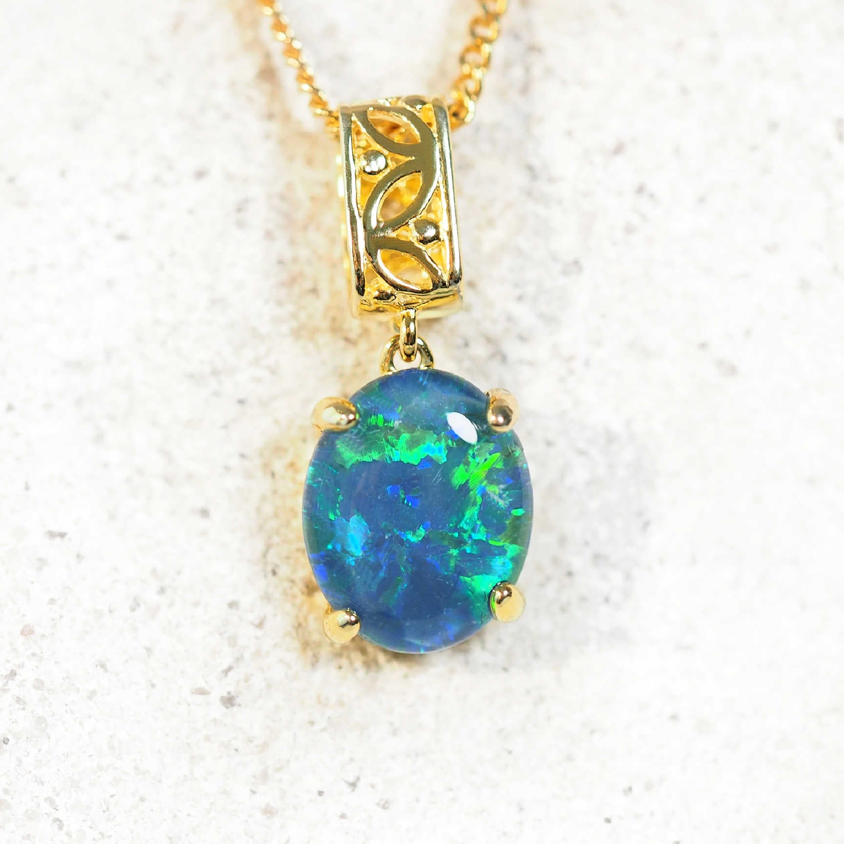 Gold-plated filigree barrel drop opal pendant with blue and green Australian triplet opal on matching chain