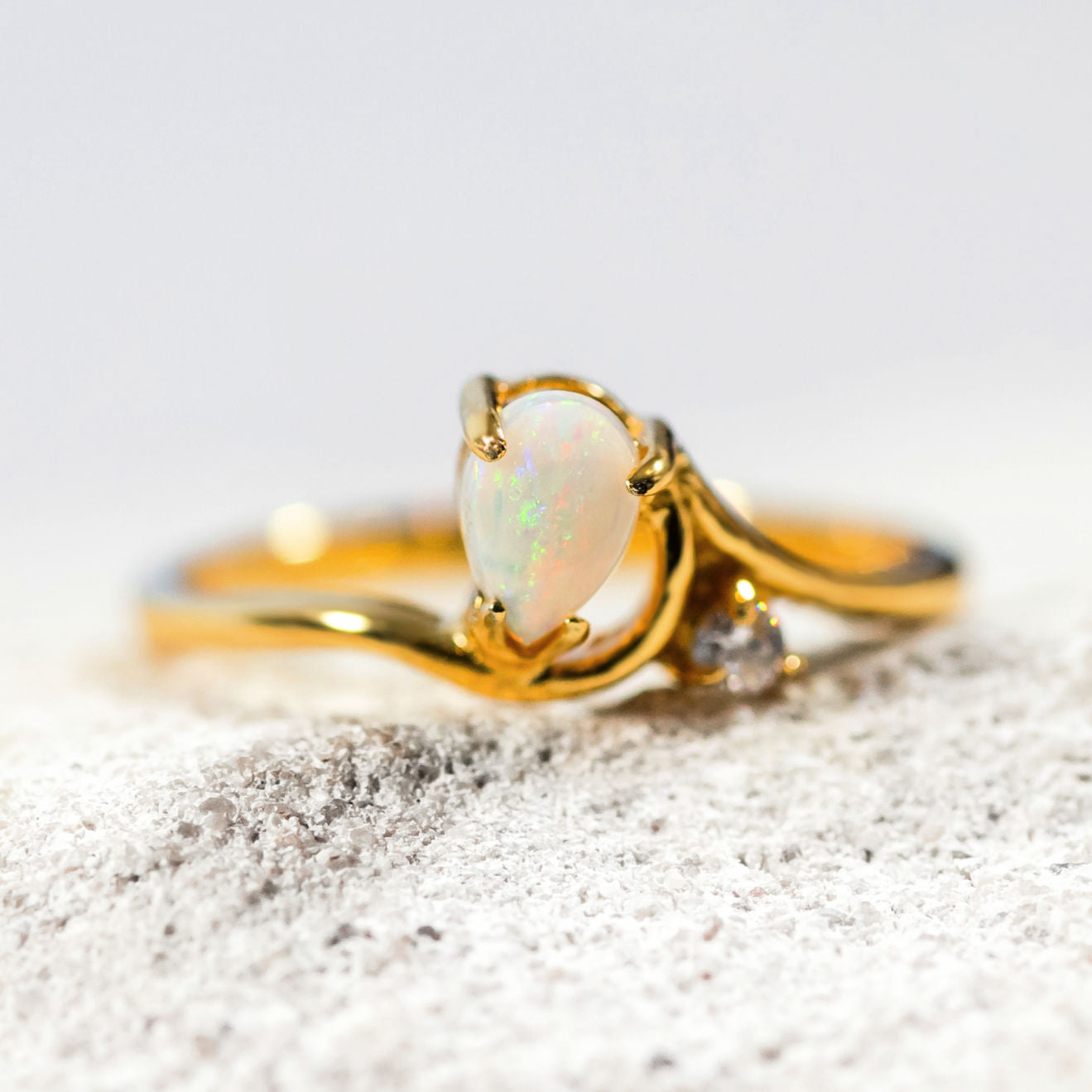 'Kiara' opal ring in gold plated silver with claw-set teardrop-shaped South Australian solid opal and sparkling cubic zirconia accent