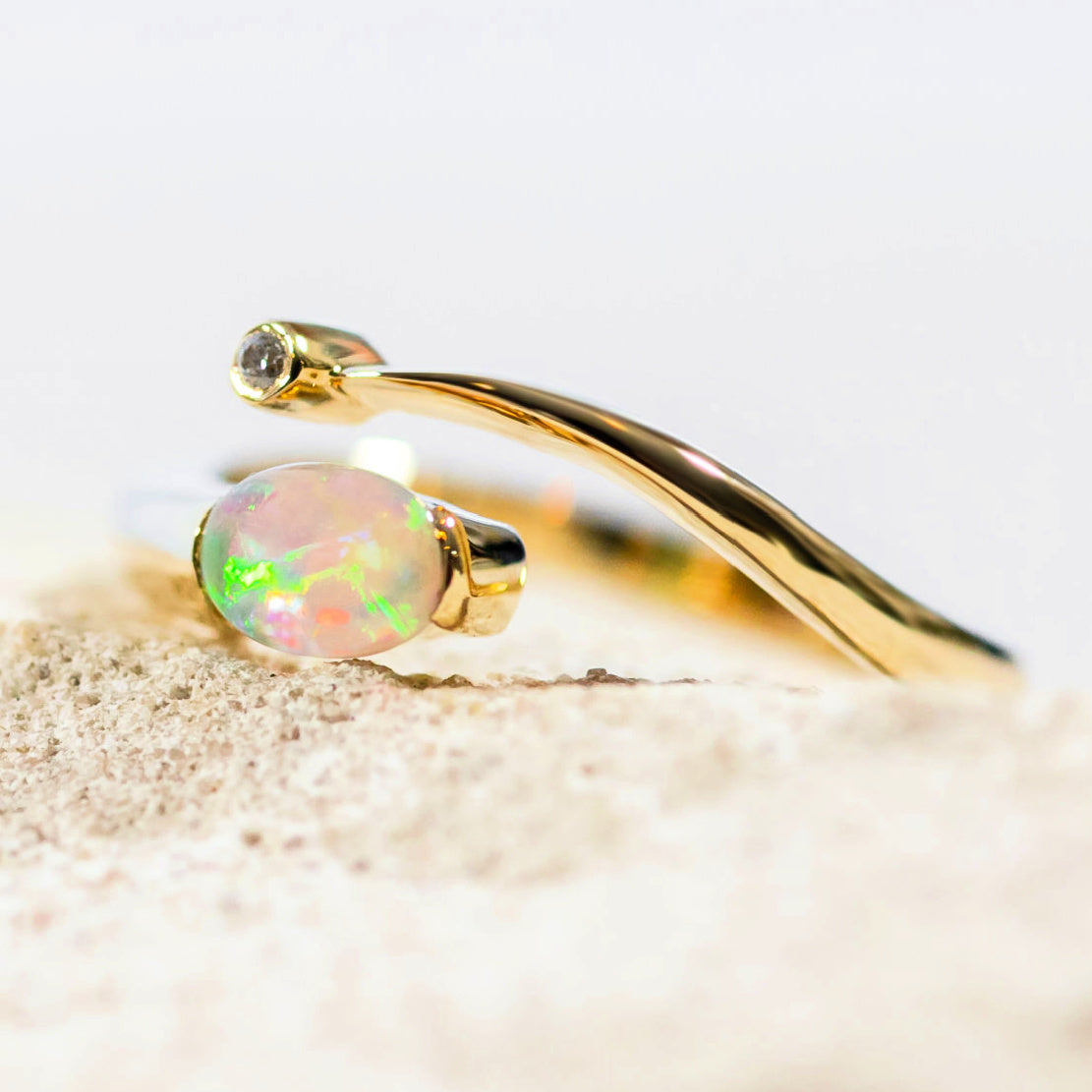 multi-colour crystal opal ring set in 14ct yellow gold with one sparkling diamond