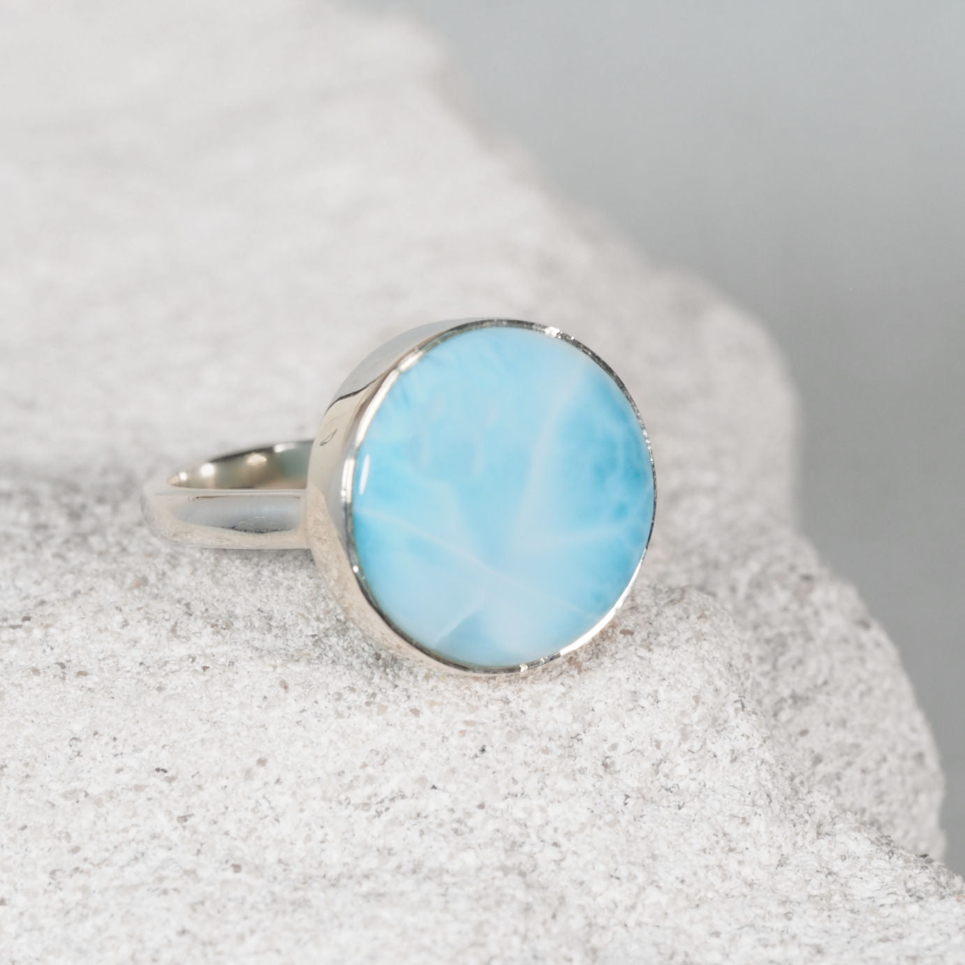 The 'Gianna' Larimar Silver Ring with light blue gemstone held in a silver frame