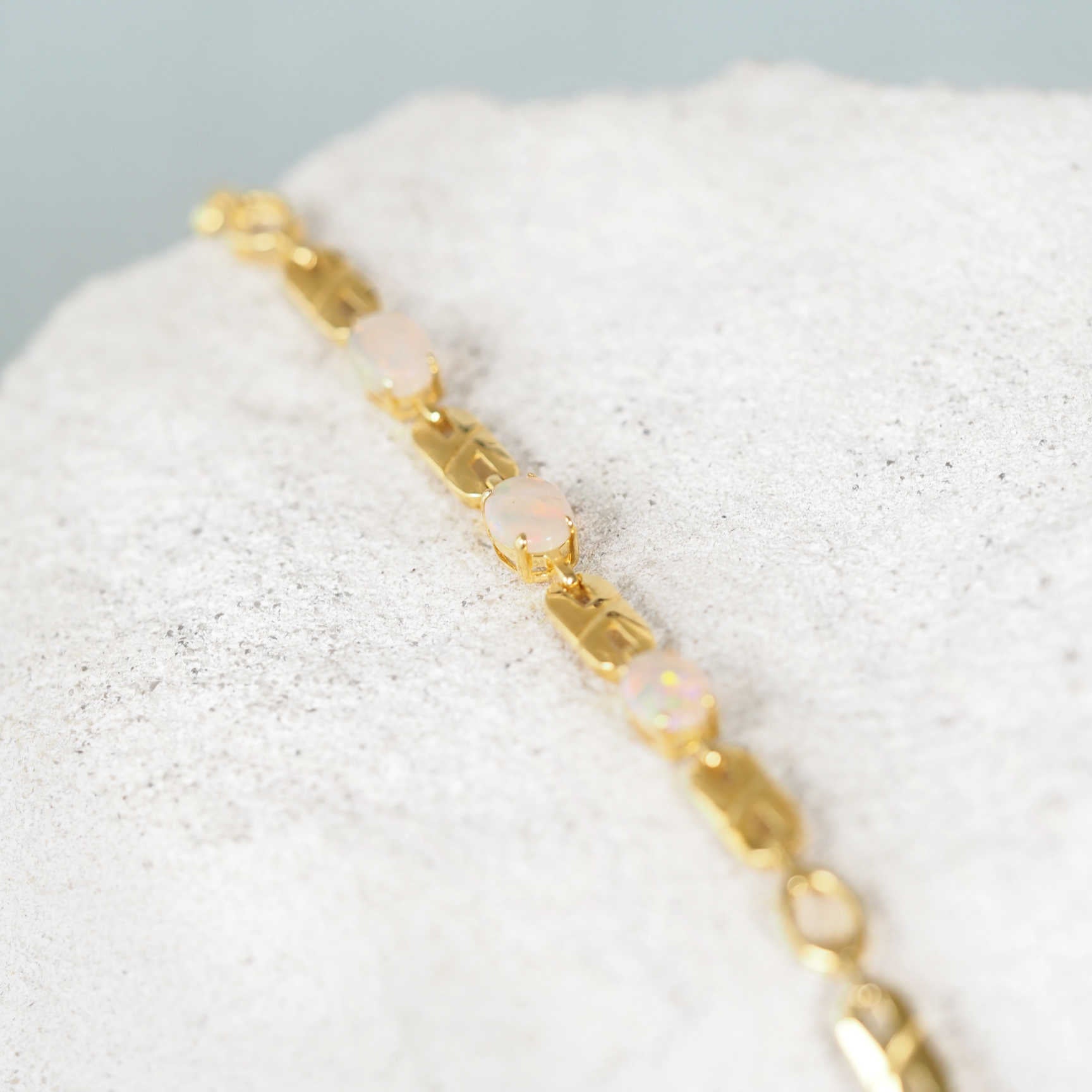 Gold plated opal bracelet with three oval South Australian white opals