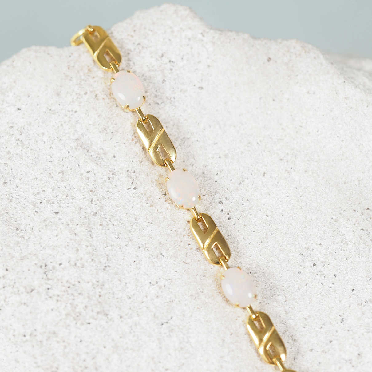 Double-link design solid opal bracelet featuring multi-coloured white opals