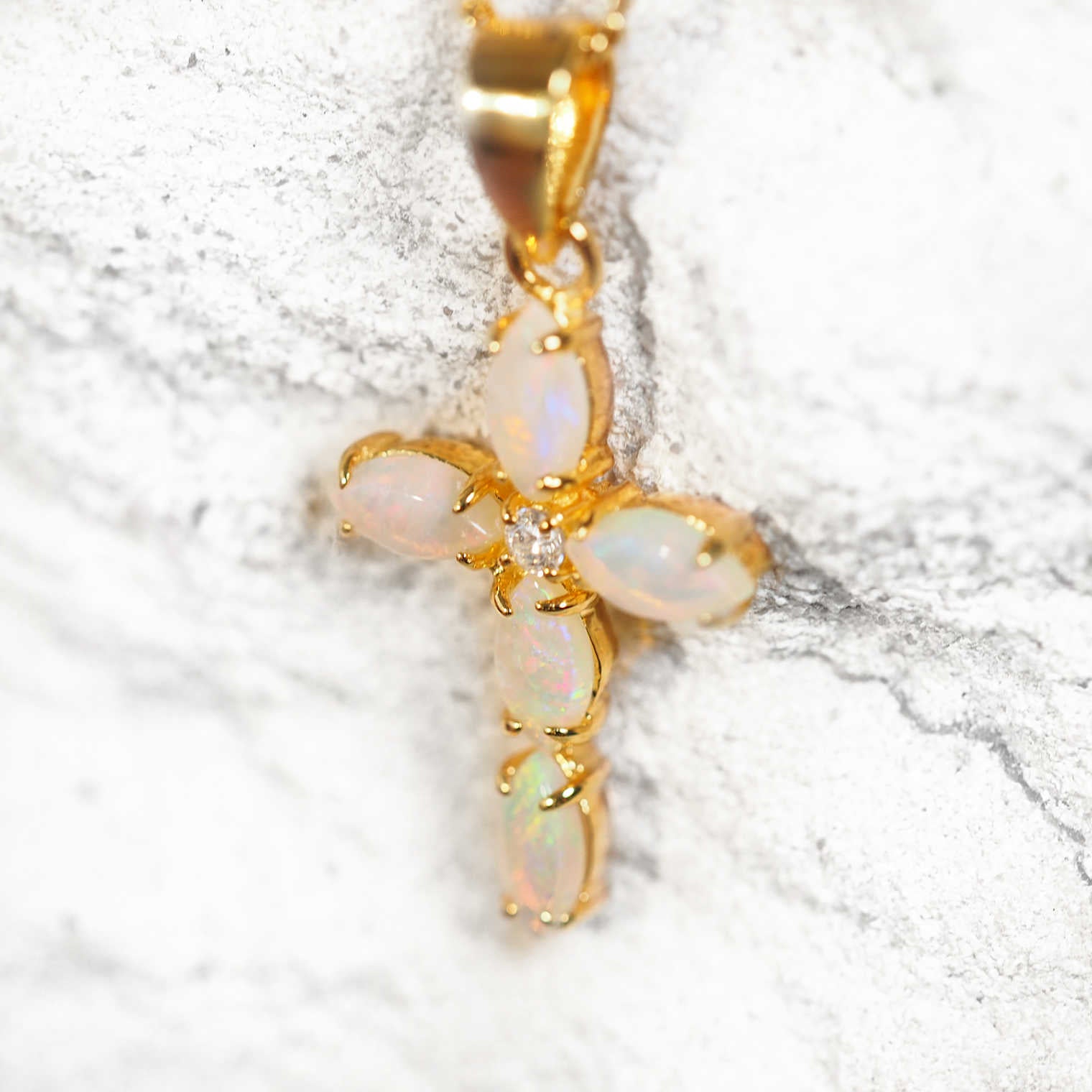 Gold-plated silver cross necklace pendant featuring colourful South Australian solid white opals and a sparkling cubic zirconia