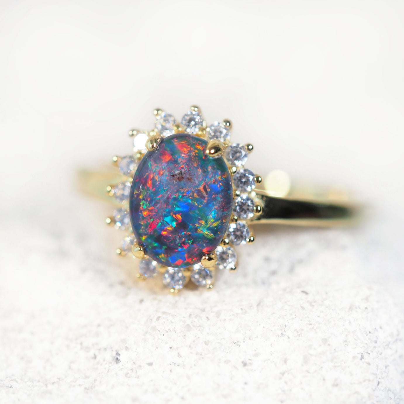 multi-colour opal ring set in gold plated silver with diamantes